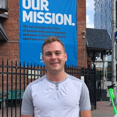 Sam Freemark, OTTAWA 2021, is pictured outside of The Ottawa Mission in June 2021. He organized weekly volunteer sessions for chapter brothers at the homeless shelter and continues to volunteer there after graduating.